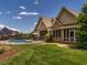 Beautiful home exterior with pool, landscaping, and outdoor living space at 3403 Raccoon Run Dr, Burlington, NC 27215