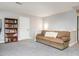 Spacious living room with a cozy couch and a bookcase at 3403 Raccoon Run Dr, Burlington, NC 27215