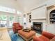 Inviting living room features built-in shelving, a fireplace, and a comfortable seating area at 3403 Raccoon Run Dr, Burlington, NC 27215