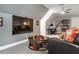 Cozy living room area with plush seating, tv, and desk at 3403 Raccoon Run Dr, Burlington, NC 27215