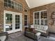 Covered patio with comfortable seating and a view of the pool at 3403 Raccoon Run Dr, Burlington, NC 27215