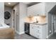 Wet bar with a wine cooler and sink, perfect for entertaining at 3403 Raccoon Run Dr, Burlington, NC 27215