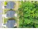 Aerial view of homes showing large backyards, screened patios, and proximity to green space at 3678 Horton Hill Dr, New Hill, NC 27562