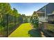 Fenced backyard boasts grill, stone patio, and mature landscaping at 3678 Horton Hill Dr, New Hill, NC 27562