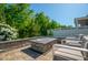 Inviting backyard patio area with outdoor seating, perfect for entertaining with fire pit and lush garden at 3678 Horton Hill Dr, New Hill, NC 27562