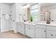 Bright bathroom features double vanities, neutral tones, and modern fixtures at 3678 Horton Hill Dr, New Hill, NC 27562