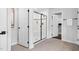Bathroom boasts glass enclosed shower with white tiling and contrasting black trim at 3678 Horton Hill Dr, New Hill, NC 27562