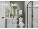 Well-lit bathroom features modern fixtures, a glass shower, and neutral color palette at 3678 Horton Hill Dr, New Hill, NC 27562