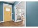 Inviting entryway with stylish yellow front door, and home office through glass French doors at 3678 Horton Hill Dr, New Hill, NC 27562