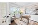 Bright home office with hardwood floors, large window, desk, chair, and modern decor at 3678 Horton Hill Dr, New Hill, NC 27562
