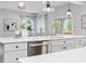 Modern kitchen featuring white countertops, pendant lighting, and stainless steel appliances at 3678 Horton Hill Dr, New Hill, NC 27562