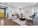 Bright and airy living room with hardwood floors and stylish furnishings with views of the front door at 3678 Horton Hill Dr, New Hill, NC 27562