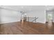 Spacious living area featuring hardwood floors, natural light, and neutral walls at 3678 Horton Hill Dr, New Hill, NC 27562