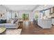 Open-concept living room with hardwood floors and sliding glass doors to outdoor deck at 3678 Horton Hill Dr, New Hill, NC 27562