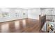 Bright living room with hardwood floors, staircase, and ample natural light at 3678 Horton Hill Dr, New Hill, NC 27562