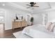 Bright bedroom with hardwood floors, a dresser, and access to en-suite bath at 3678 Horton Hill Dr, New Hill, NC 27562