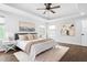 Spacious main bedroom with modern decor, hardwood floors, and plenty of light at 3678 Horton Hill Dr, New Hill, NC 27562