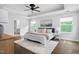Inviting main bedroom features a tray ceiling, stylish ceiling fan, and natural light at 3678 Horton Hill Dr, New Hill, NC 27562