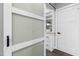 A walk-in pantry featuring custom shelving, drawers, and a sliding glass door at 3678 Horton Hill Dr, New Hill, NC 27562