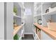 A walk-in pantry featuring custom shelving and drawers and a small window at 3678 Horton Hill Dr, New Hill, NC 27562
