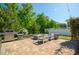 Outdoor patio boasts a fire pit, grill, and beautiful landscaping at 3678 Horton Hill Dr, New Hill, NC 27562