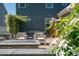 Back patio with lounge seating, fire pit, dining table, and string lights at 3678 Horton Hill Dr, New Hill, NC 27562
