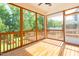 Enclosed wooden porch with exposed beams and views of the wooded yard at 3678 Horton Hill Dr, New Hill, NC 27562