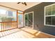 Cozy screened-in porch with wood flooring, sliding glass door, and backyard access at 3678 Horton Hill Dr, New Hill, NC 27562