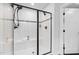 This modern shower features a glass door, bench seating, and updated fixtures at 3678 Horton Hill Dr, New Hill, NC 27562
