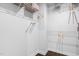 Spacious walk-in closet with white wire shelving and dark wood floors offering ample storage space at 3678 Horton Hill Dr, New Hill, NC 27562