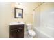 A full bathroom with a single sink vanity and a shower and tub combination at 3945 Amelia Park Dr, Raleigh, NC 27606