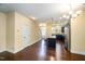 Inviting space seamlessly integrates the kitchen and living area, featuring hardwood floors and neutral paint at 3945 Amelia Park Dr, Raleigh, NC 27606