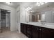 This bathroom has a dual sink vanity, a walk in closet, a private toilet room, and a tile shower at 4 Seawell Ct, Durham, NC 27703