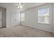 This bedroom features neutral carpeting and large windows for plenty of natural light at 4 Seawell Ct, Durham, NC 27703