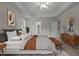 This spacious bedroom features a ceiling fan, tray ceiling, and ensuite bathroom access at 4 Seawell Ct, Durham, NC 27703