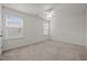 This bedroom features neutral carpeting and large windows for plenty of natural light at 4 Seawell Ct, Durham, NC 27703