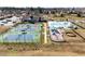 Aerial view of the community amenities including tennis courts, playground, pool, and clubhouse at 4 Seawell Ct, Durham, NC 27703