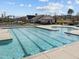 Community swimming pool with lap lanes, a separate area with steps, and a clear blue water at 4 Seawell Ct, Durham, NC 27703