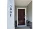 Close-up of the front door showcasing house number 3009 and a stylish, covered entry at 4002 Silver Oak Ln # 96, Durham, NC 27703