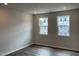 Bedroom area with hardwood floors, light walls, and natural light at 4002 Silver Oak Ln, Durham, NC 27703