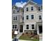 New townhome shows a charming exterior with stone accents and a welcoming entrance at 4002 Silver Oak Ln, Durham, NC 27703