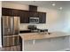 Close up on the kitchen, showcasing stainless steel appliances and granite countertops at 4002 Silver Oak Ln, Durham, NC 27703