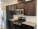 View of the stainless steel appliances and gas range cooktop in the kitchen at 4002 Silver Oak Ln, Durham, NC 27703