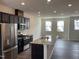 Modern kitchen features stainless appliances, granite countertops, and ample cabinet space at 4002 Silver Oak Ln, Durham, NC 27703
