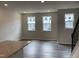 Bright, open living room area with modern flooring and plenty of natural light at 4002 Silver Oak Ln, Durham, NC 27703