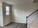 View of a room with modern flooring and stairs leading to upper level at 4002 Silver Oak Ln, Durham, NC 27703