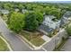 Aerial view of a well-maintained home with mature trees and a manicured lawn at 401 Haywood St, Raleigh, NC 27601