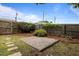 The backyard features a paved area, mature trees, and a wooden fence, offering a versatile outdoor space at 401 Haywood St, Raleigh, NC 27601