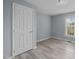 Bright bedroom features wood-look flooring, a large window, and a closet at 401 Haywood St, Raleigh, NC 27601