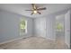 Cozy bedroom features a ceiling fan, a window with natural light, and wood-look flooring at 401 Haywood St, Raleigh, NC 27601